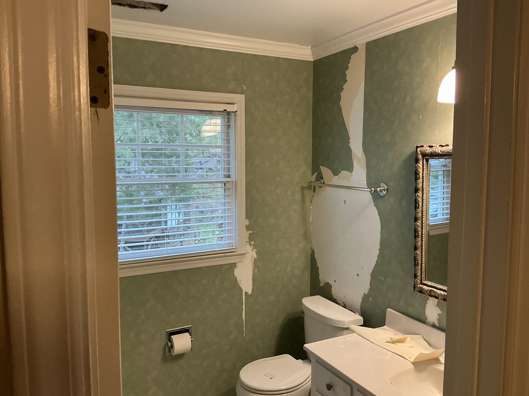 Bathroom before, peeling wallpaper