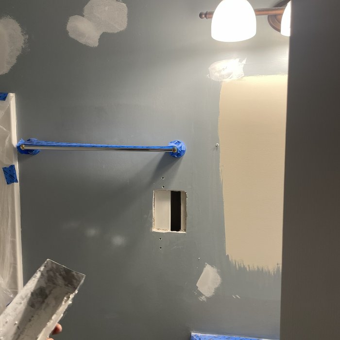 Hole enlarged to fit new drywall patch